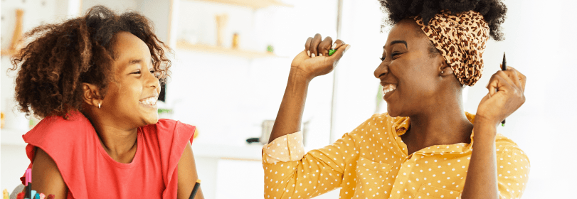 Young person and teacher smiling