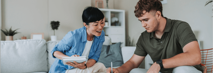 Image of a teacher and young person working together