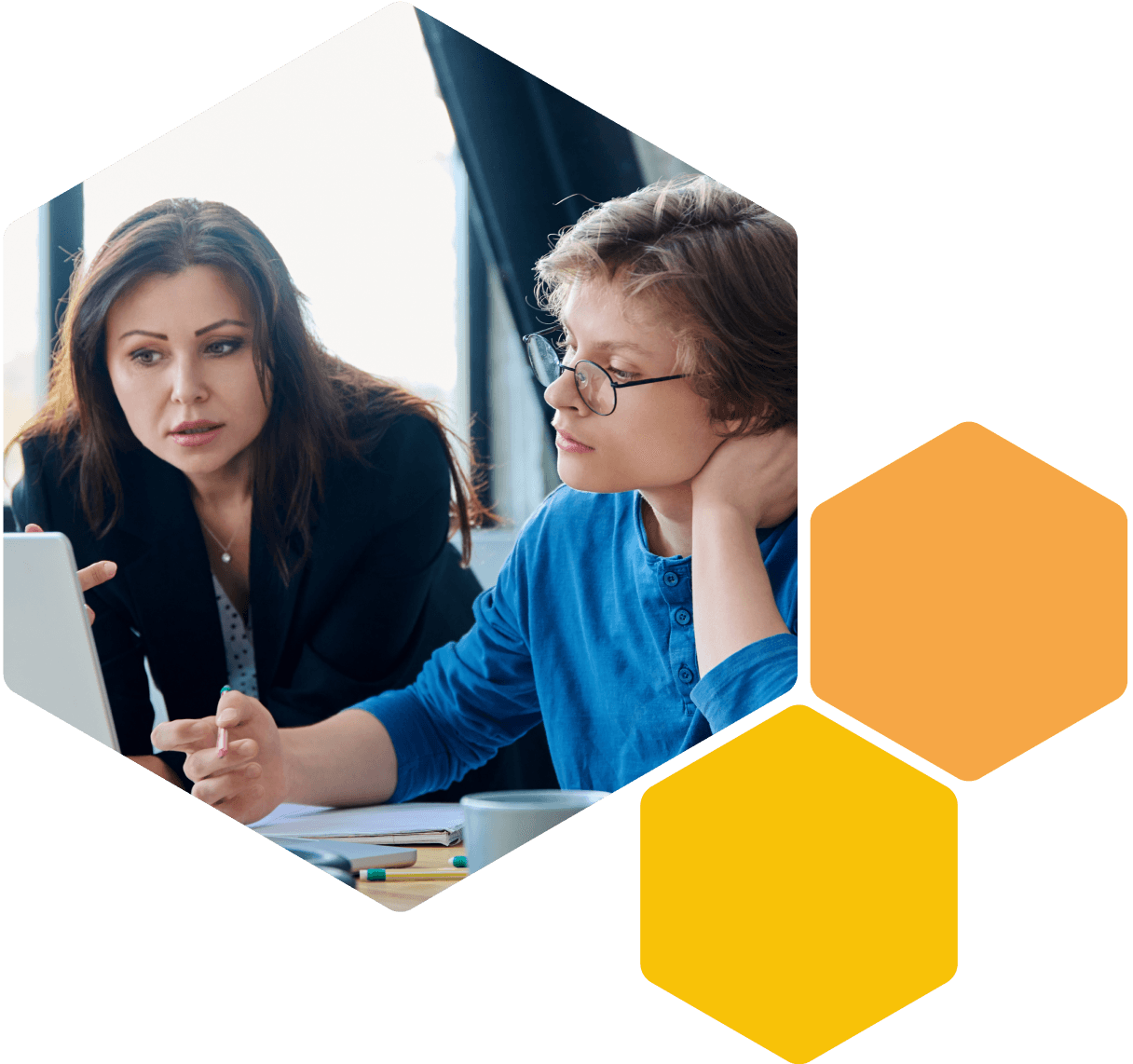 Image of a young person and teacher working together